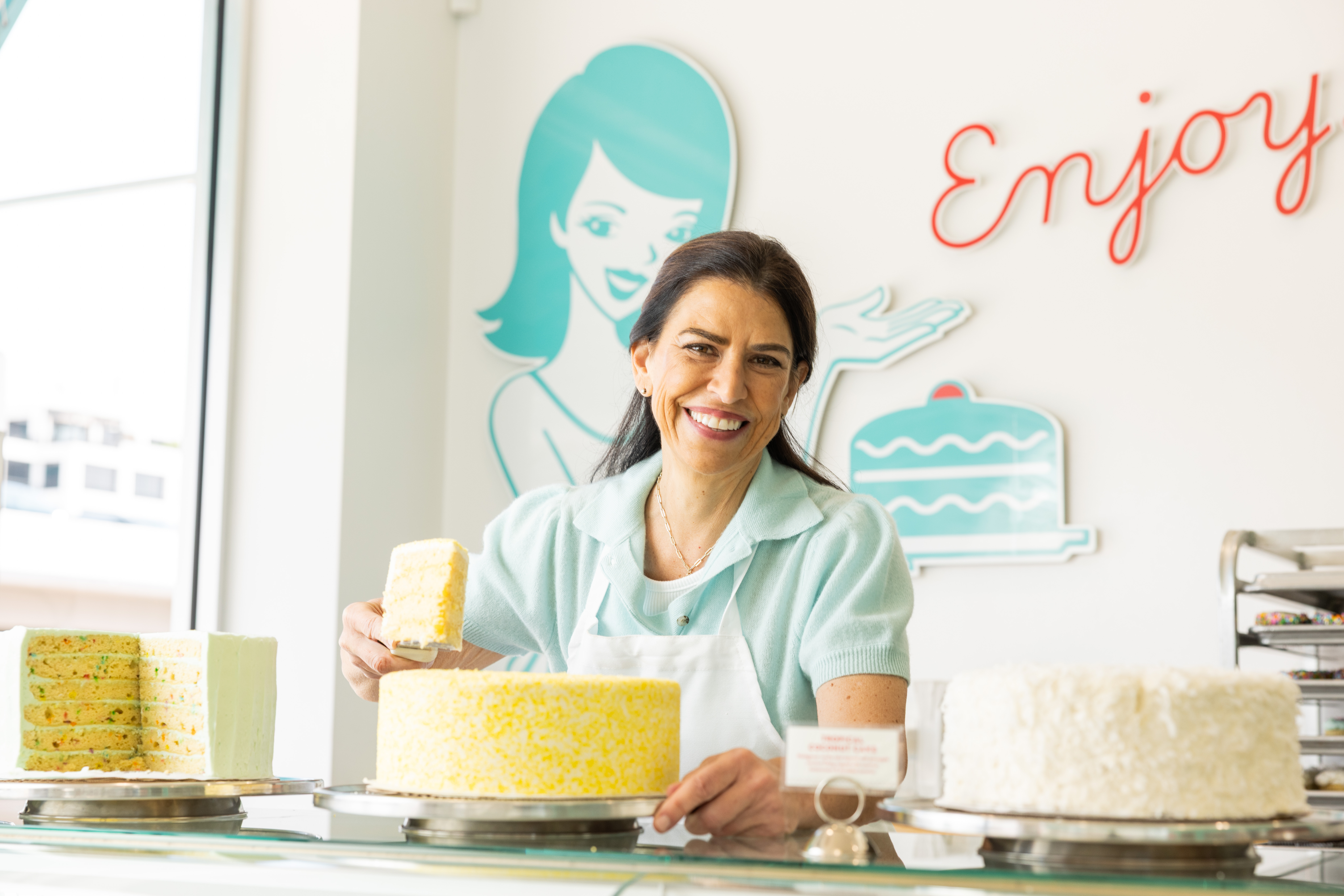 Susie opening door to her shop