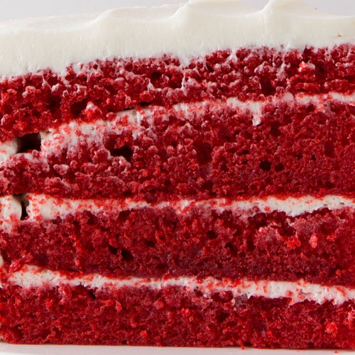 Up close image of the 4-layers of red velvet cake. view 3